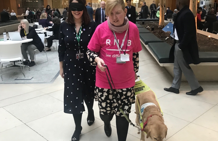 Fay Jones MP with a guide dog
